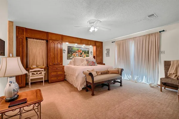 a bedroom with bed and window