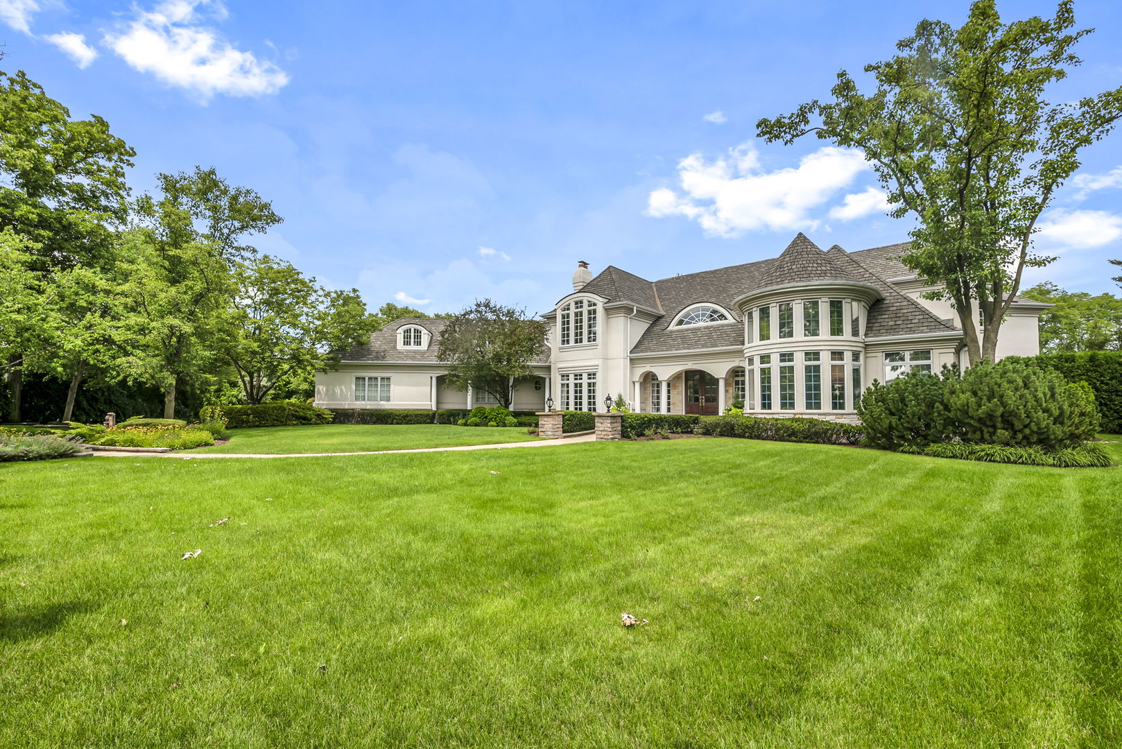 210 Indian Trail Road Oak Brook, IL 60523 - Photo 1 of 48 a front view of a house with a yard