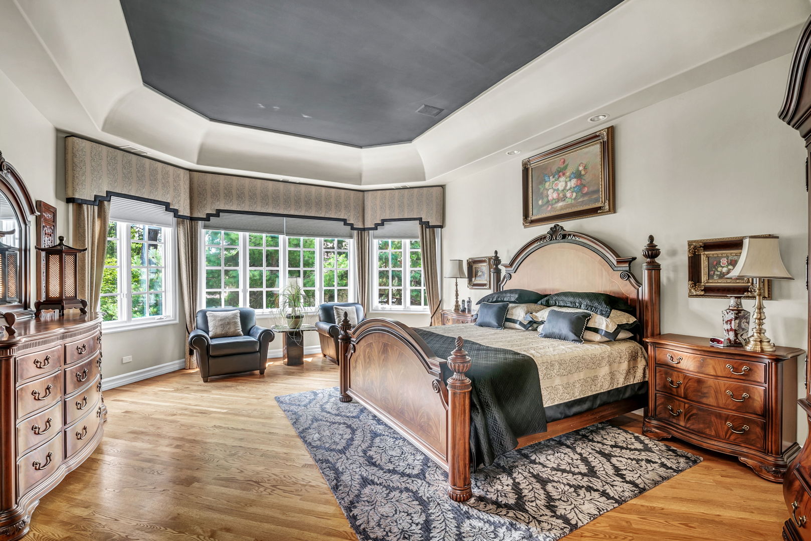 210 Indian Trail Road Oak Brook, IL 60523 - Photo 16 of 48 a bedroom with a large bed couch and a window