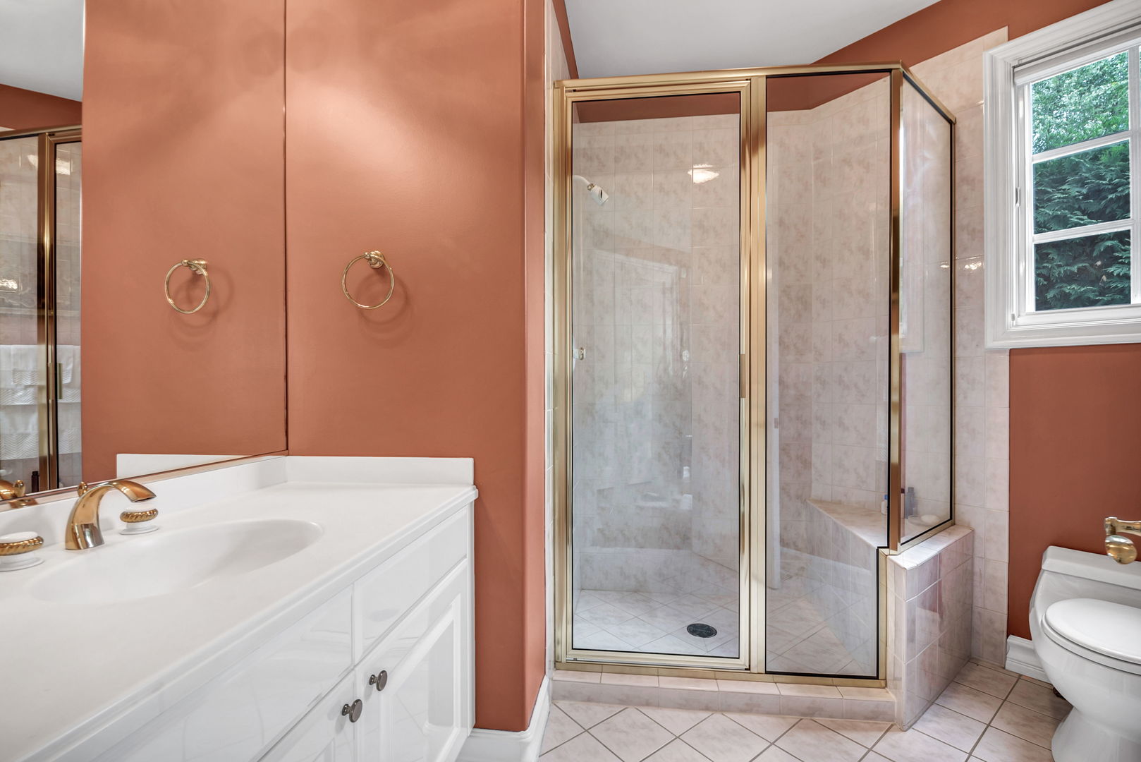 210 Indian Trail Road Oak Brook, IL 60523 - Photo 19 of 48 a bathroom with a sink a toilet and shower