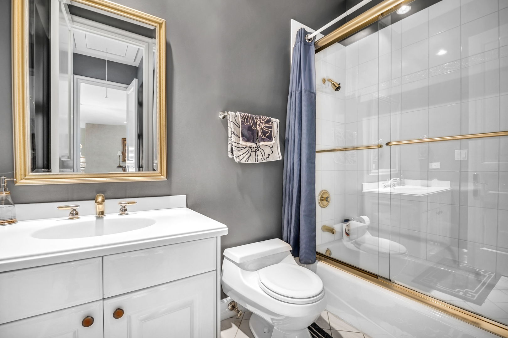 210 Indian Trail Road Oak Brook, IL 60523 - Photo 21 of 48 a bathroom with a sink toilet and shower