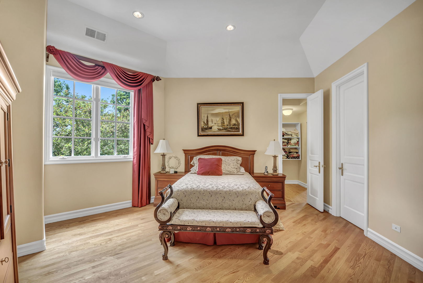 210 Indian Trail Road Oak Brook, IL 60523 - Photo 24 of 48 a bedroom with furniture and a window