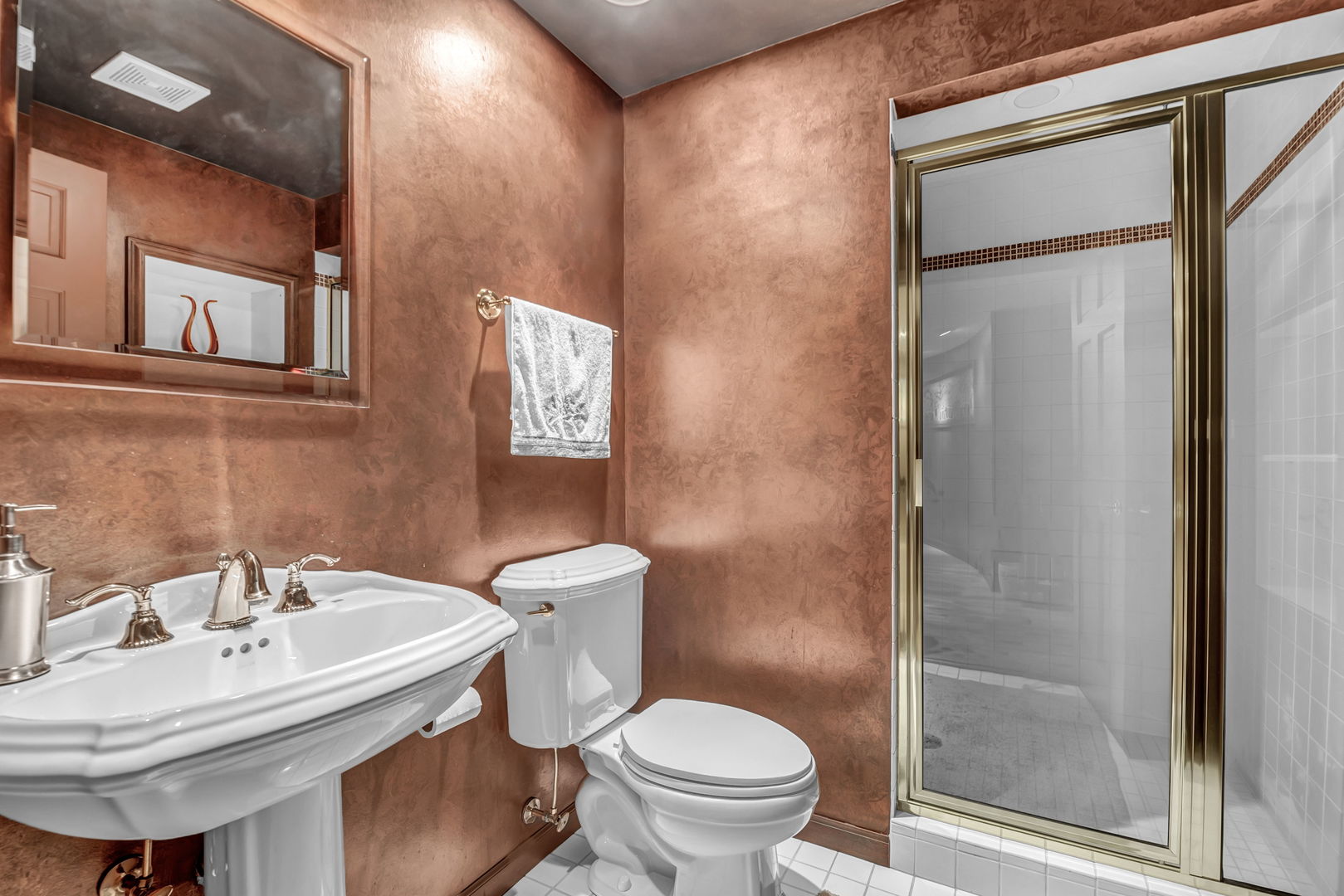 210 Indian Trail Road Oak Brook, IL 60523 - Photo 27 of 48 a bathroom with a sink toilet and a mirror
