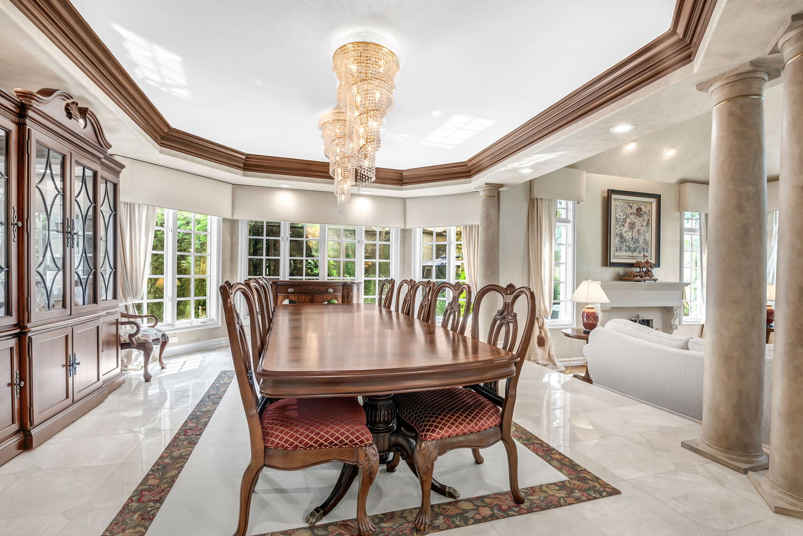 210 Indian Trail Road Oak Brook, IL 60523 - Photo 10 of 48 a dining room with furniture a chandelier and wooden floor