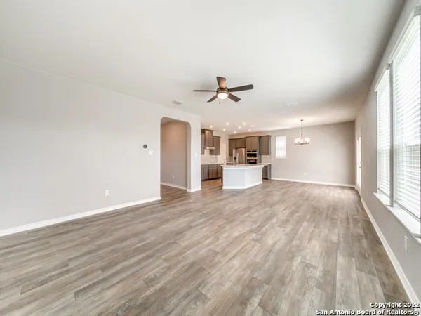 a large kitchen with kitchen island a sink stainless steel appliances and cabinets