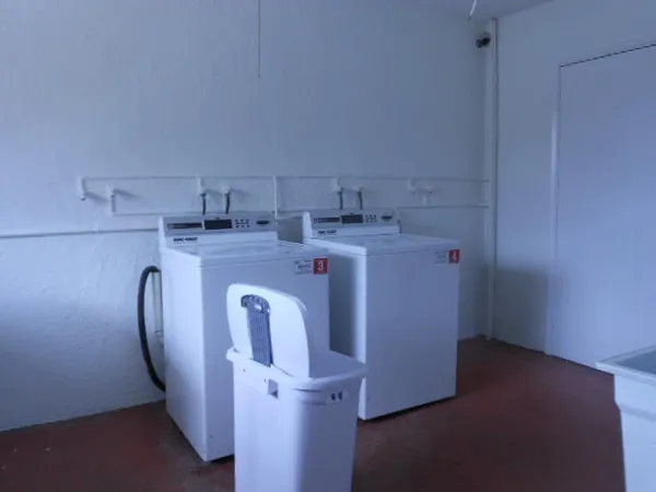 a front view of a house with a garden and patio