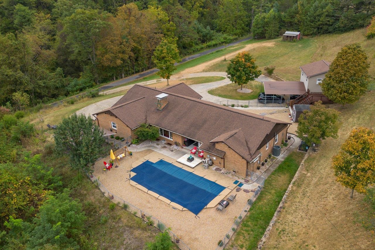 an aerial view of a house with a garden