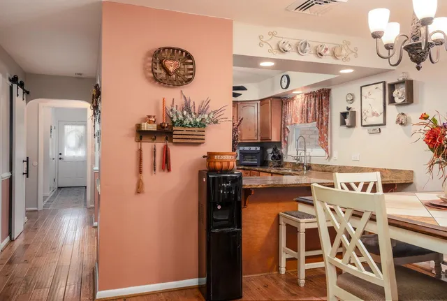 a kitchen with stainless steel appliances granite countertop a stove and a microwave