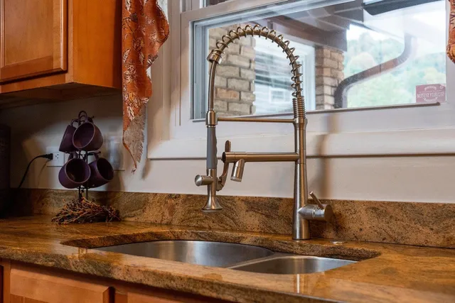 a living room with furniture a couch and a window