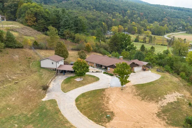 an aerial view of a house with outdoor space