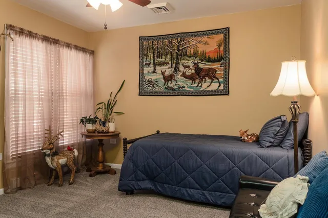 a view of a roof deck with table and chairs with wooden floor and fence