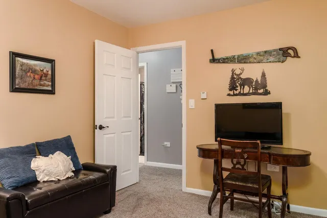 a view of a house with garden and trees