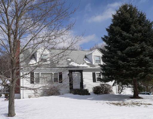 6 Mendes Road Danbury, CT 06811 - Photo 1 of 1 a front view of a house with a yard covered in snow