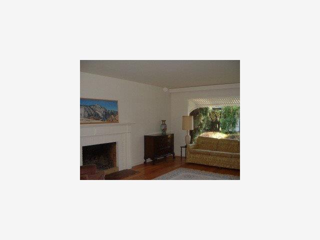 670 Covington Road Los Altos, CA 94024 - Photo 6 of 8 a living room with furniture and a fireplace