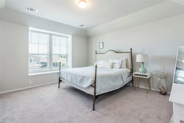 a living room with furniture and a ceiling fan
