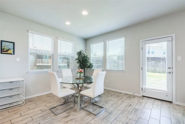 a open kitchen with stainless steel appliances kitchen island granite countertop a sink and cabinets
