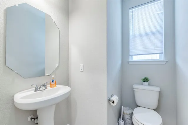 a workspace room with furniture and windows