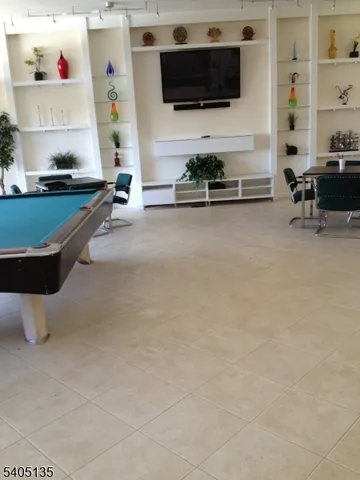 a room with furniture and a flat screen tv