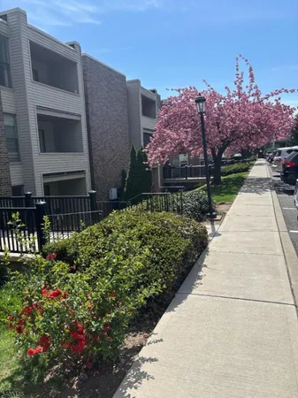 a view of a pathway with a house in the background
