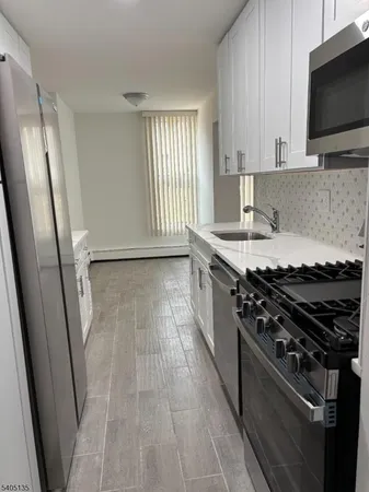 a kitchen with a stove and a microwave