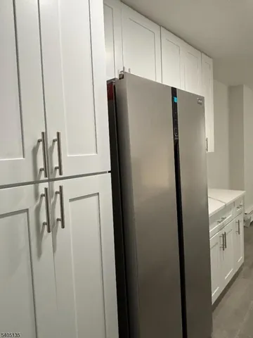 a white refrigerator freezer sitting inside of a kitchen