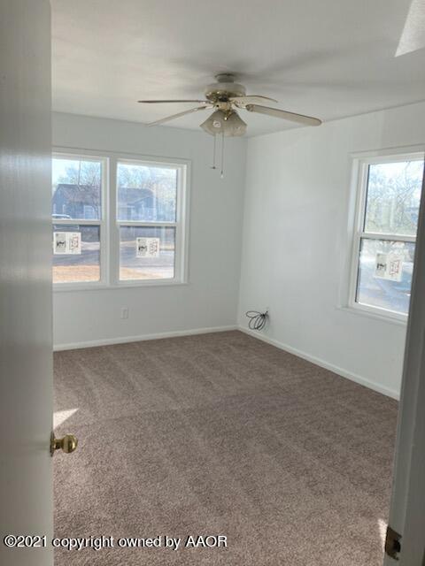 4608 Preston Street Amarillo, TX 79110 - Photo 5 of 9 a view of an empty room with a window