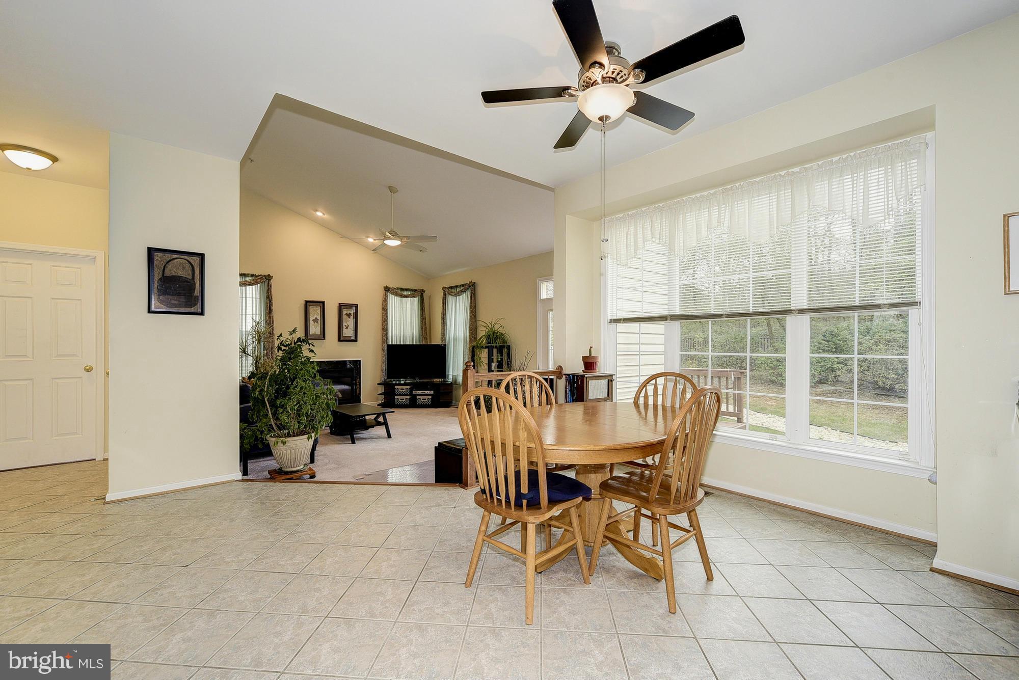 11204 Snowden Pond Road Laurel, MD 20708 - Photo 11 of 30 a view of a dining room with furniture and a window