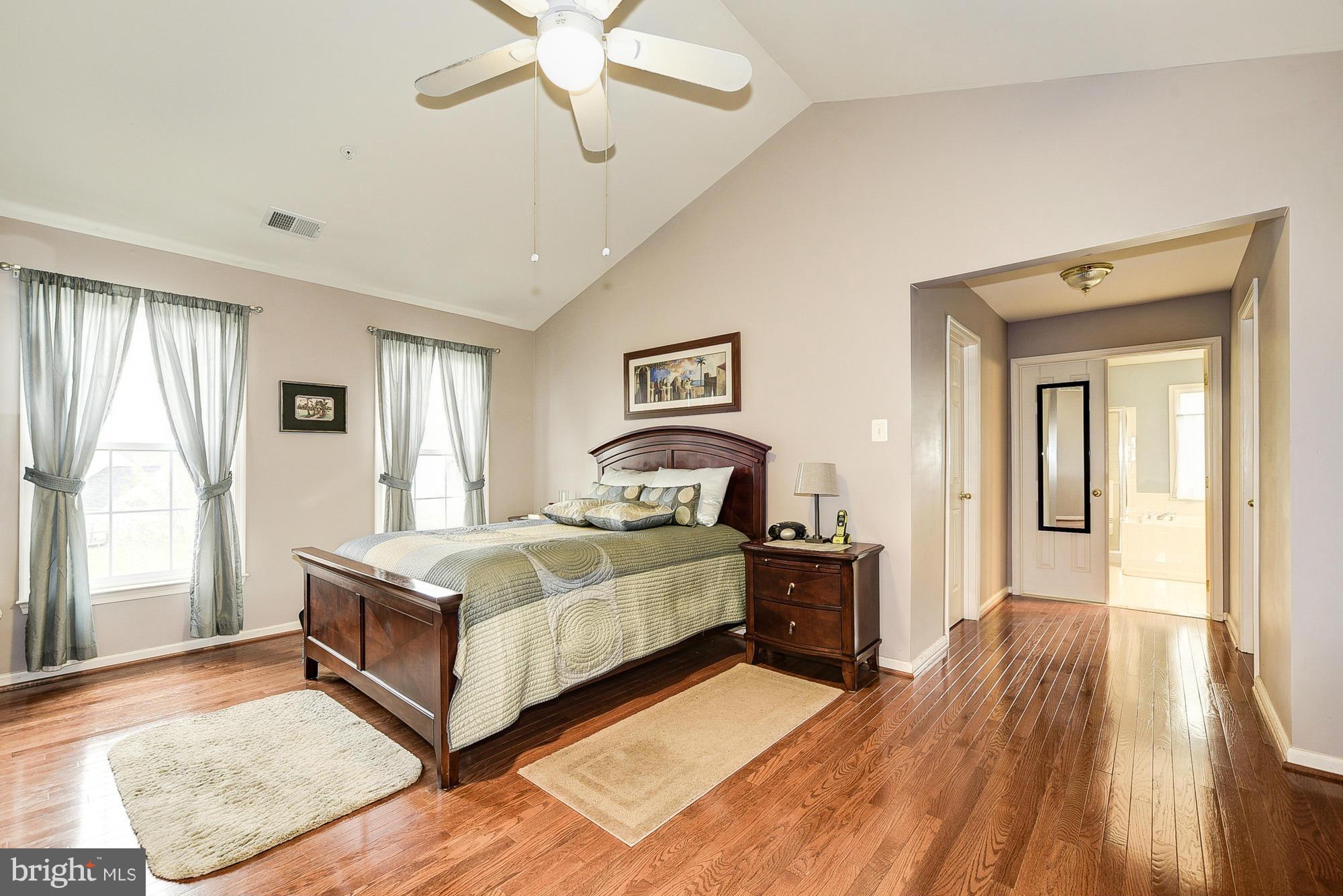 11204 Snowden Pond Road Laurel, MD 20708 - Photo 15 of 30 a bed room with a bed and window