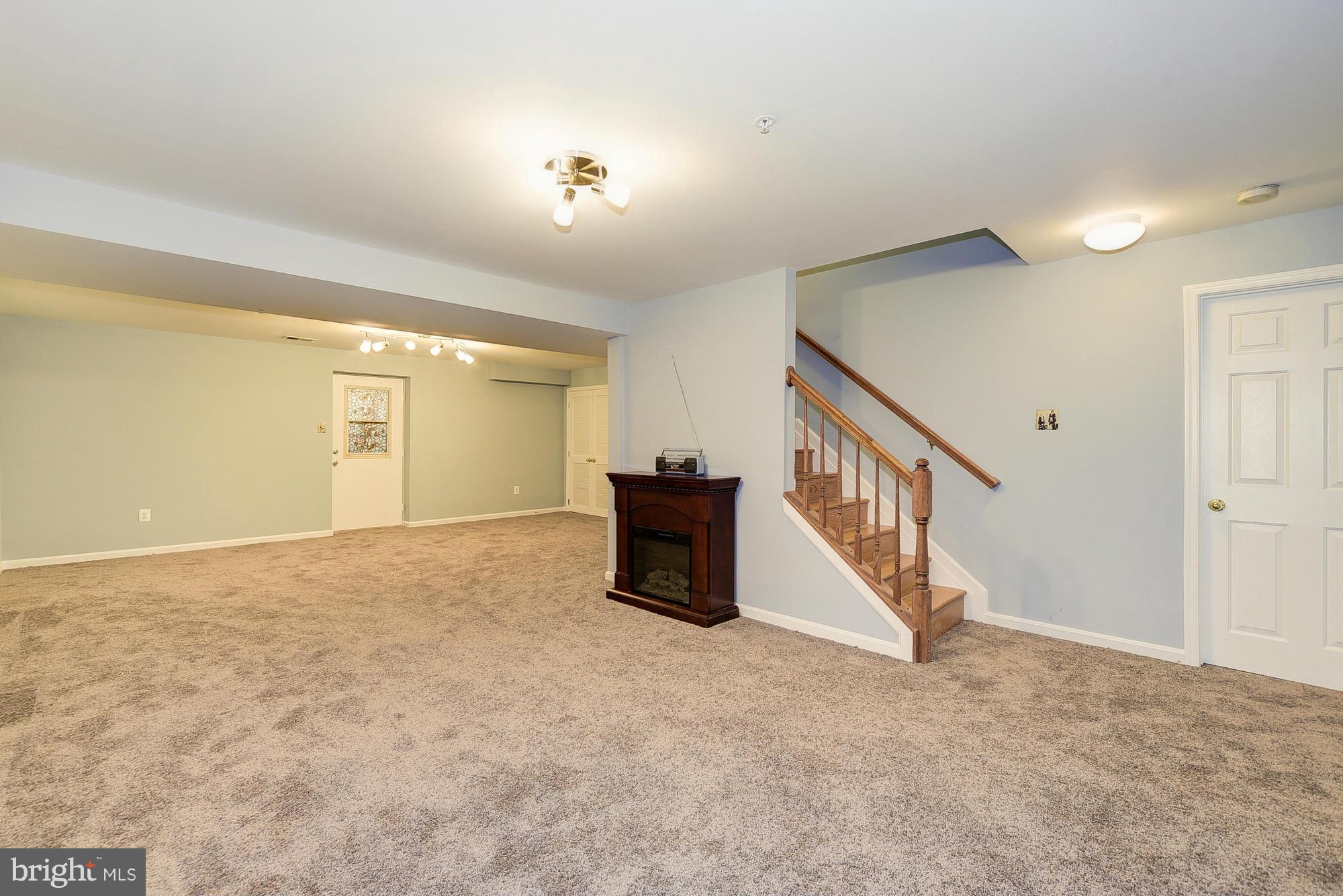 11204 Snowden Pond Road Laurel, MD 20708 - Photo 25 of 30 a view of an empty room with stairs