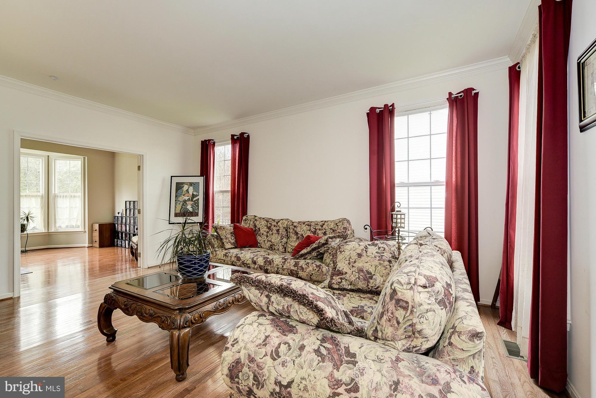 11204 Snowden Pond Road Laurel, MD 20708 - Photo 4 of 30 a living room with furniture and a wooden floor