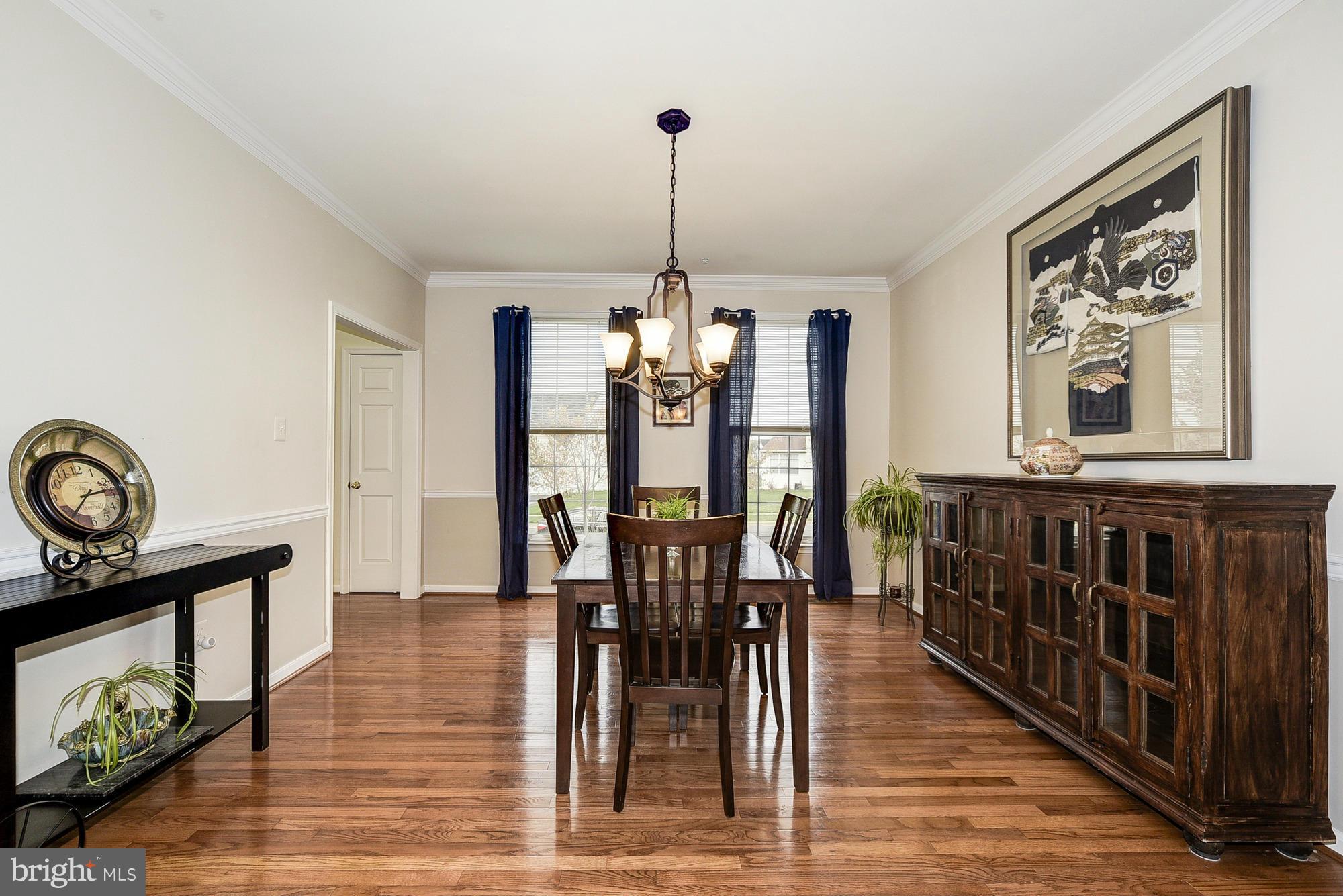 11204 Snowden Pond Road Laurel, MD 20708 - Photo 5 of 30 a dining room with furniture window and wooden floor