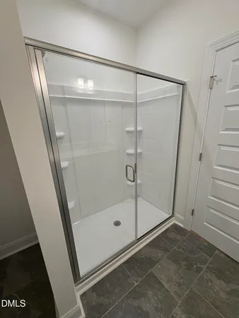 a bathroom with a double vanity sink and mirror