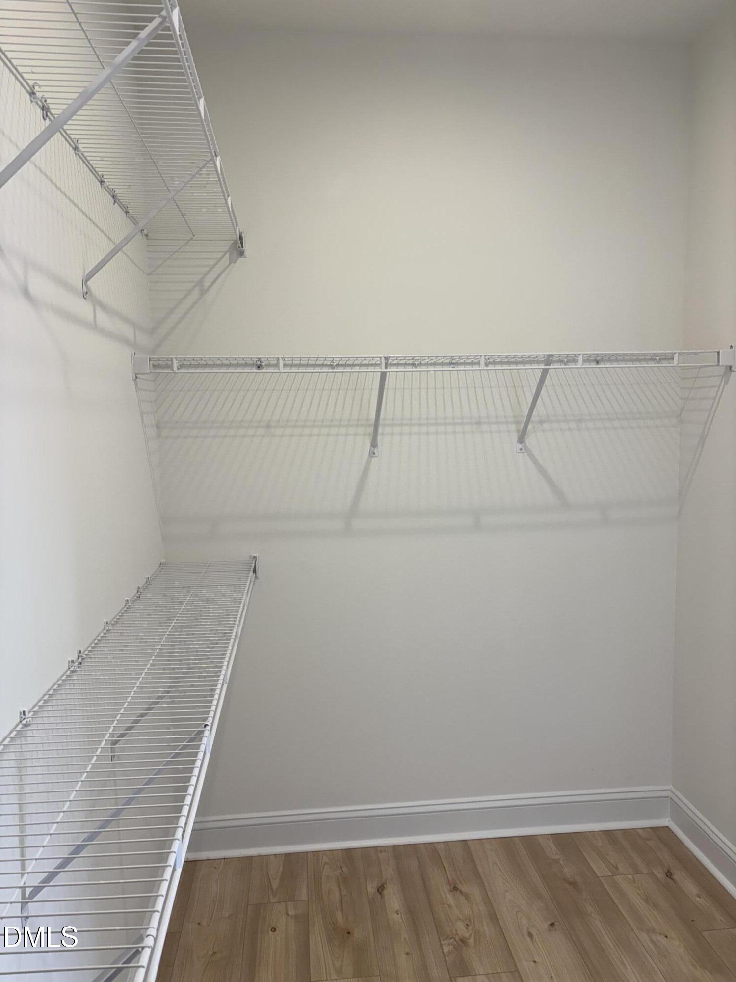 618 Weather Ridge Lane, Unit 28 Cary, NC 27513 - Photo 16 of 27 a view of a room with racks on the wall