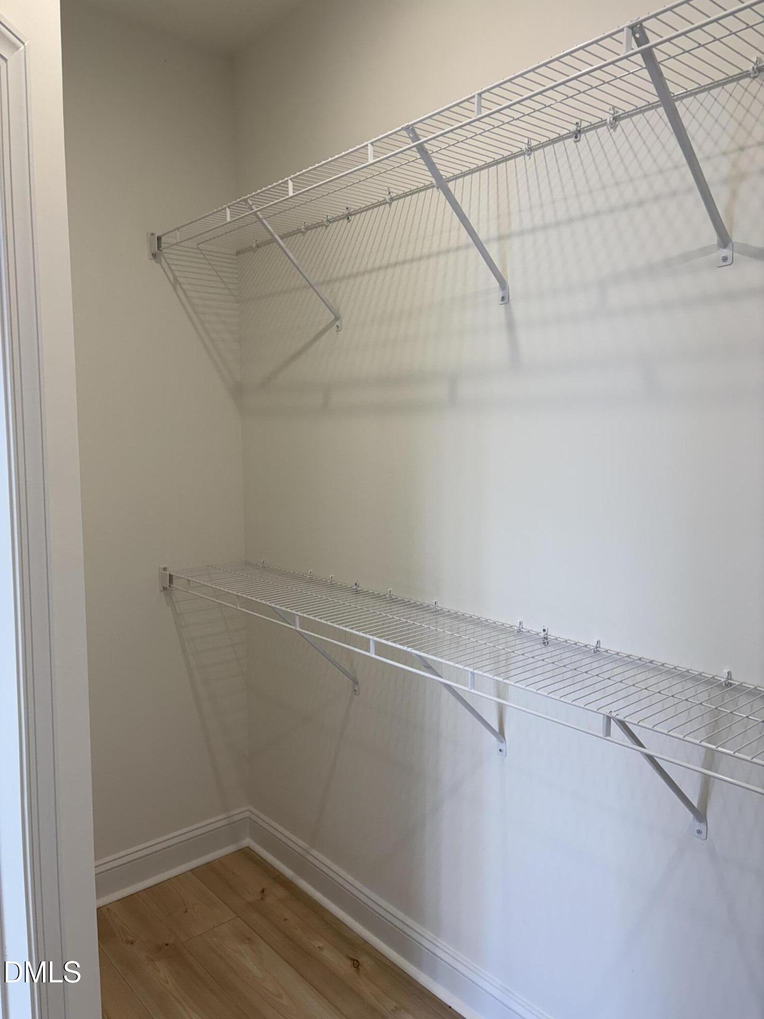 618 Weather Ridge Lane, Unit 28 Cary, NC 27513 - Photo 17 of 27 a view of a room with racks on the wall