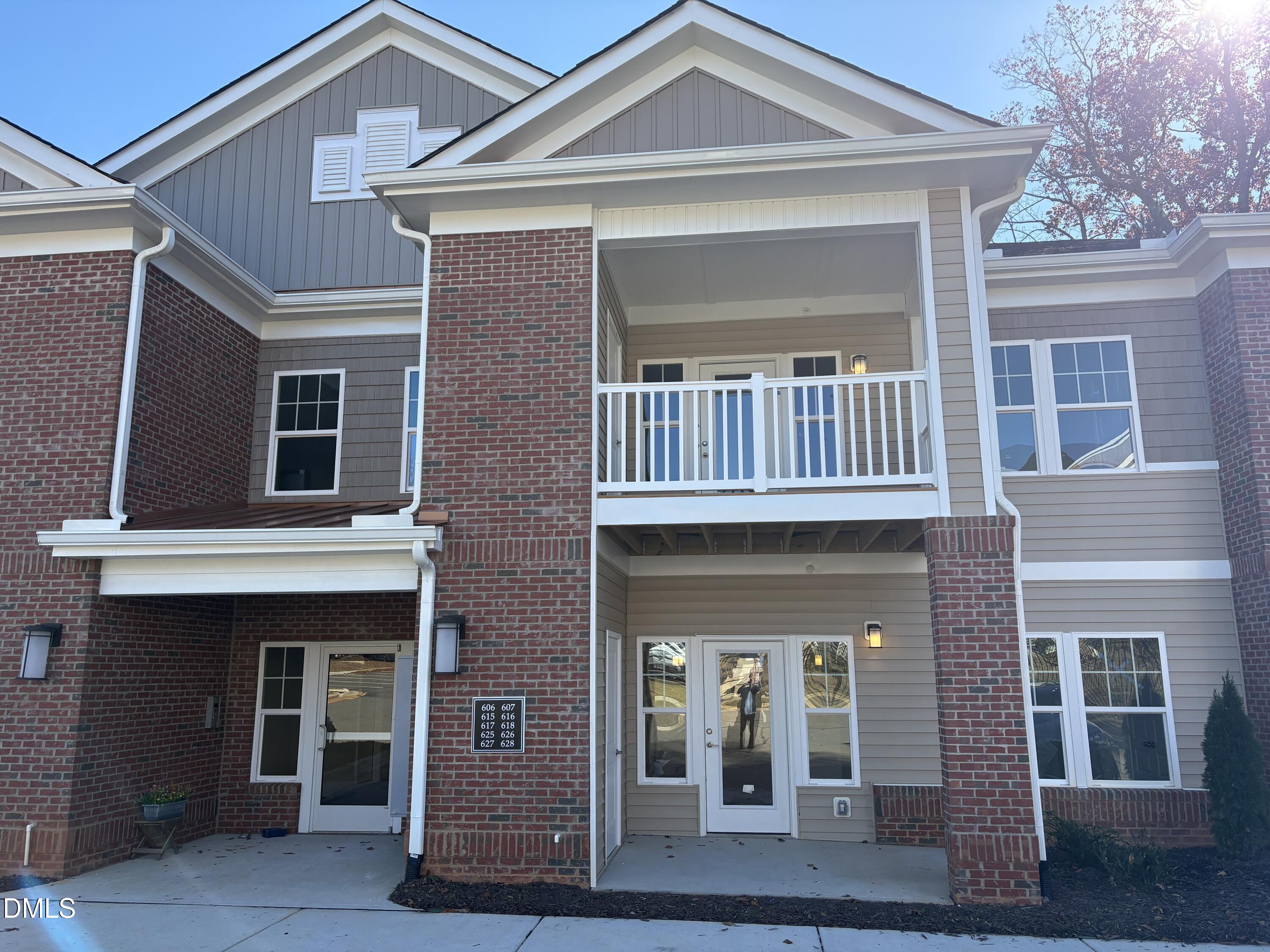 618 Weather Ridge Lane, Unit 28 Cary, NC 27513 - Photo 2 of 27 a front view of a house with glass windows