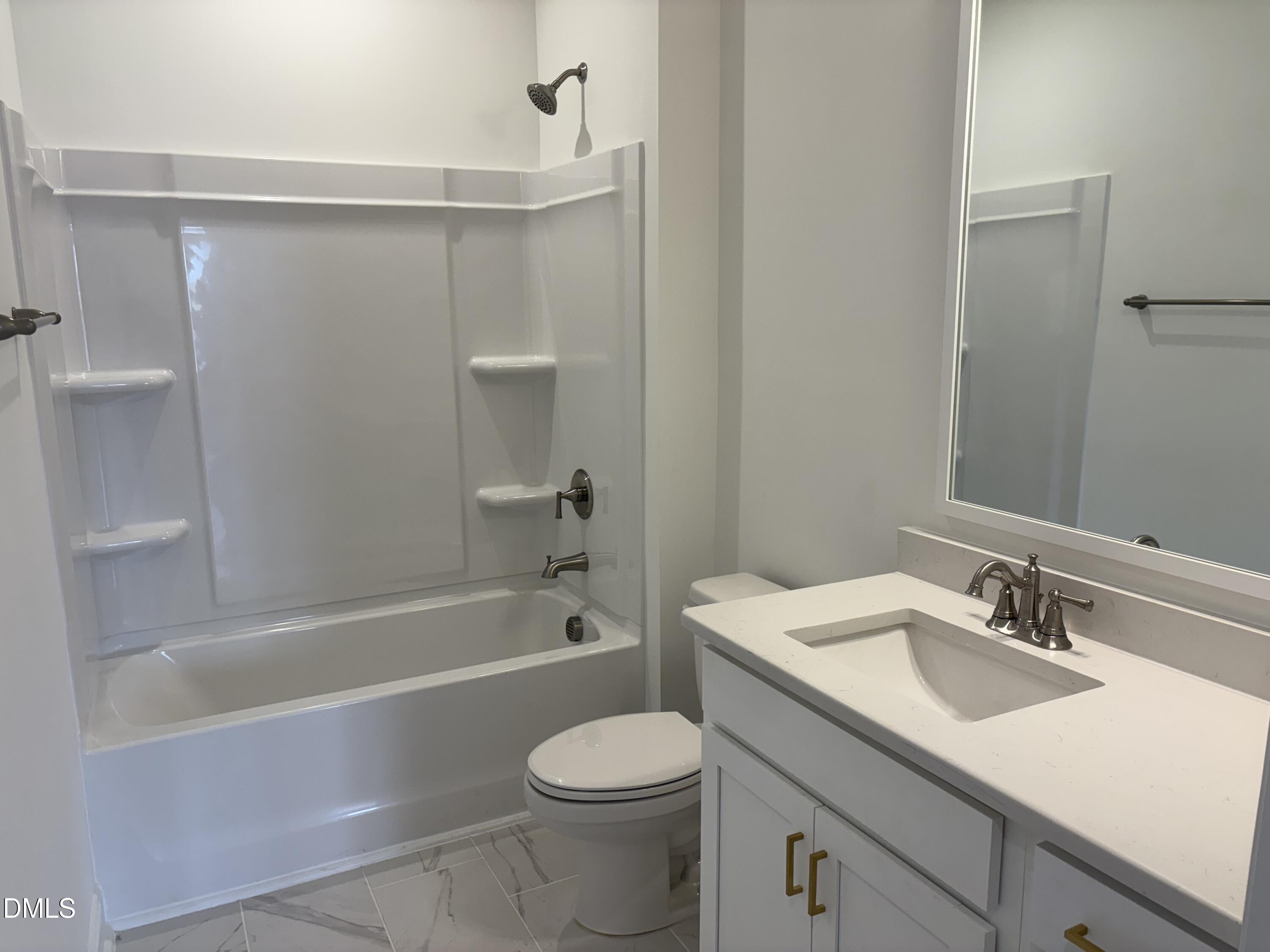 618 Weather Ridge Lane, Unit 28 Cary, NC 27513 - Photo 21 of 27 a bathroom with a sink toilet and shower
