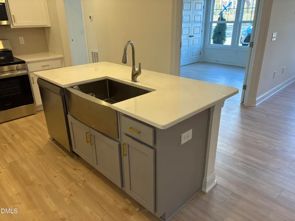 a kitchen with a stove and a microwave