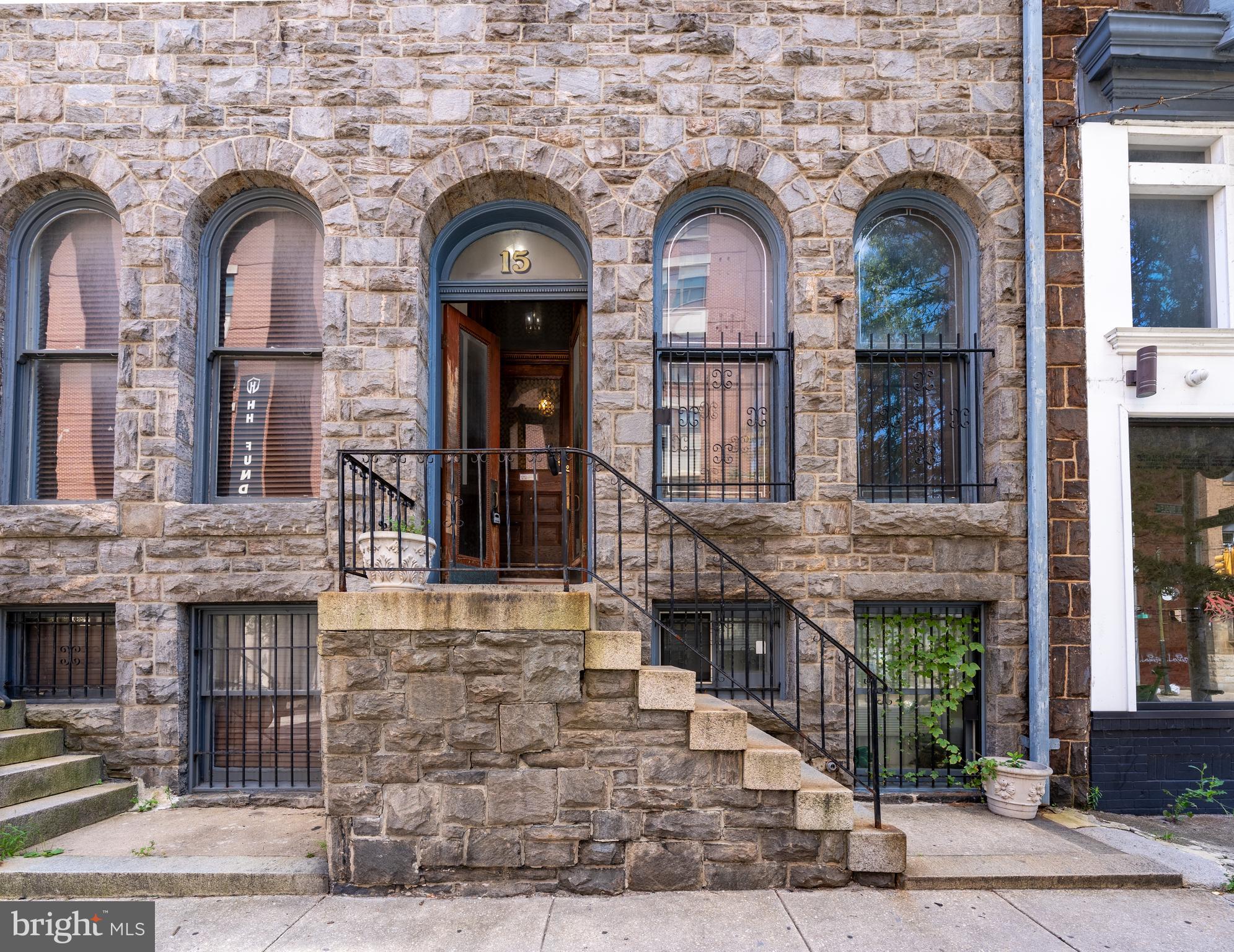 15 West Biddle Street, Unit 15C Baltimore, MD 21201 - Photo 1 of 33 a front view of a house with large windows