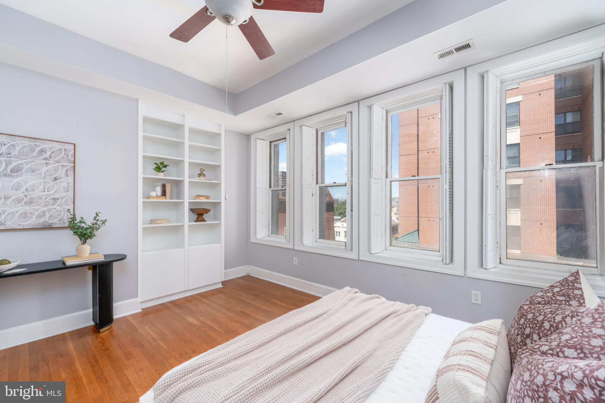 15 West Biddle Street, Unit 15C Baltimore, MD 21201 - Photo 14 of 33 a bedroom with a large bed and a window