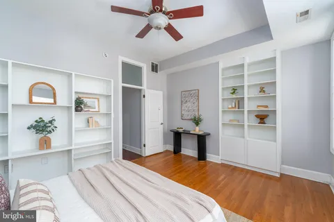 a bedroom with a bed and a cabinets