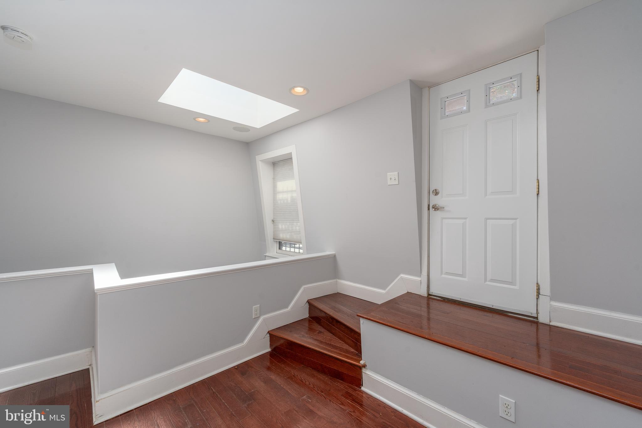 15 West Biddle Street, Unit 15C Baltimore, MD 21201 - Photo 25 of 33 a view of room with wooden floor