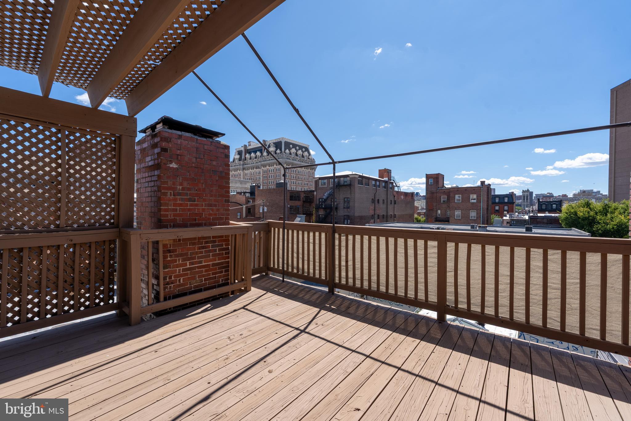 15 West Biddle Street, Unit 15C Baltimore, MD 21201 - Photo 26 of 33 a view of a balcony with wooden floor