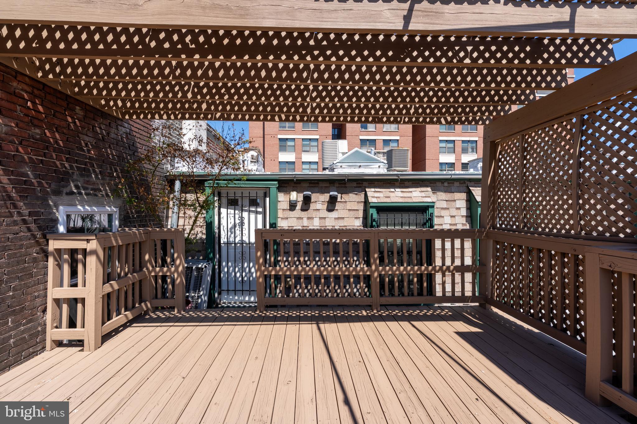15 West Biddle Street, Unit 15C Baltimore, MD 21201 - Photo 27 of 33 a view of a deck with wooden floor