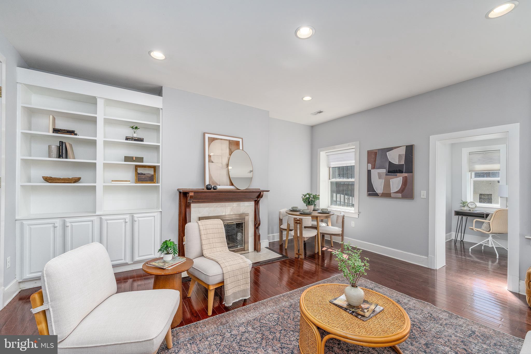 15 West Biddle Street, Unit 15C Baltimore, MD 21201 - Photo 4 of 33 a living room with furniture and a wooden floor