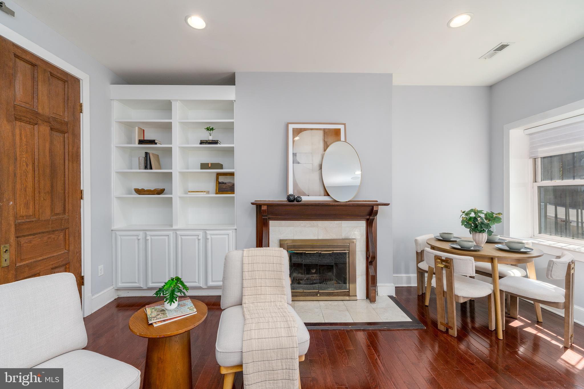 15 West Biddle Street, Unit 15C Baltimore, MD 21201 - Photo 5 of 33 a living room with furniture and a fireplace