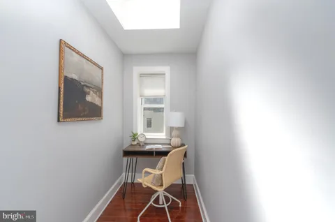 a view of a room that has a table and chair