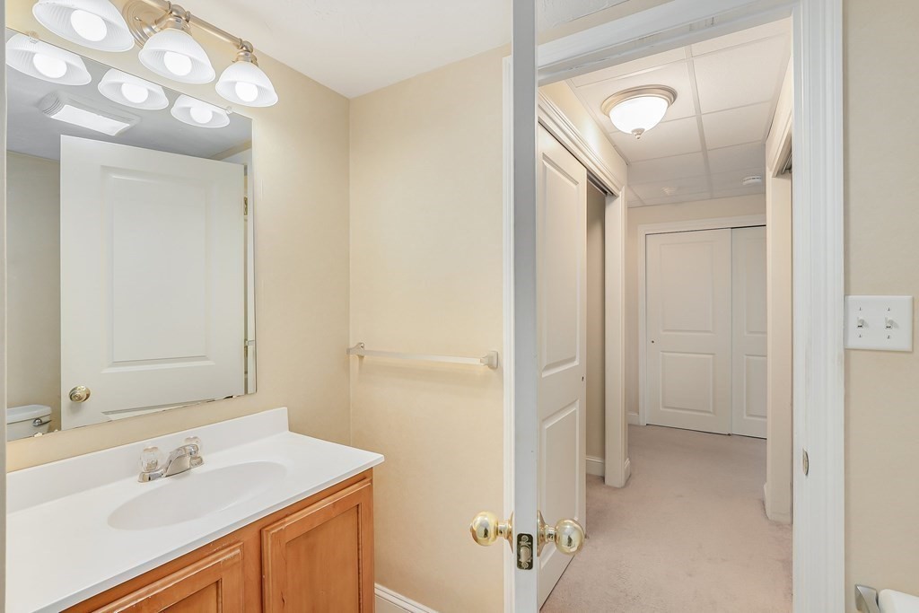 1500 Worcester Road, Unit 710 Framingham, MA 01702 - Photo 17 of 33 a bathroom with a sink mirror and a shower