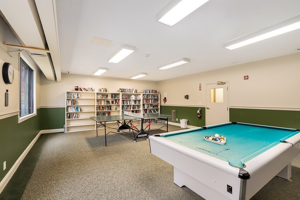 1500 Worcester Road, Unit 710 Framingham, MA 01702 - Photo 20 of 33 a living room with furniture pool table and projector room