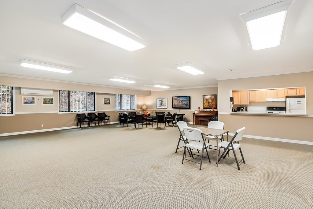 1500 Worcester Road, Unit 710 Framingham, MA 01702 - Photo 26 of 33 a view of a dining room with furniture and a livingroom