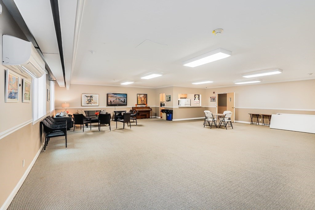 1500 Worcester Road, Unit 710 Framingham, MA 01702 - Photo 27 of 33 a living room with furniture and a couch